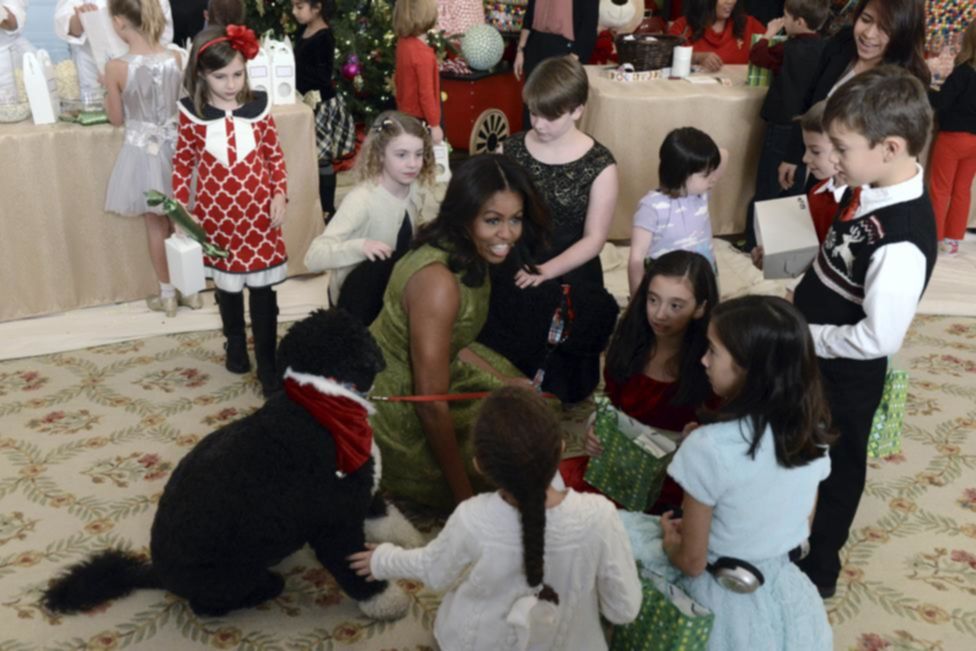First Lady Michelle Obama welcomes children of military families to holiday festivities at the White House